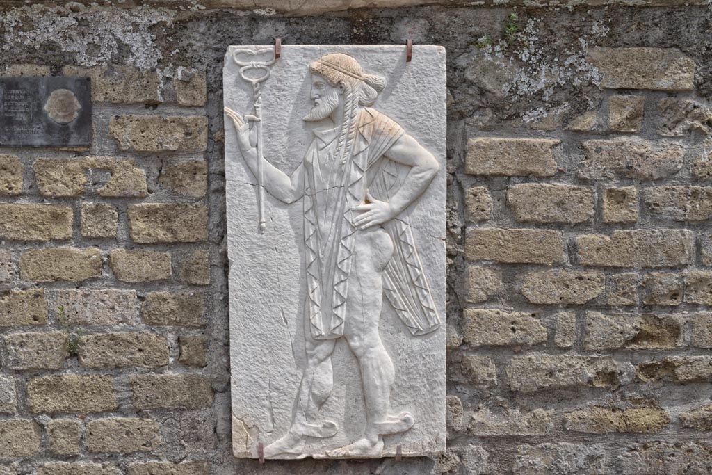 Herculaneum, April 2018. Reproduction relief of Mercury, from the shrine of Four Gods on the Sacred Area terrace.
Photo courtesy of Ian Lycett-King. Use is subject to Creative Commons Attribution-NonCommercial License v.4 International.